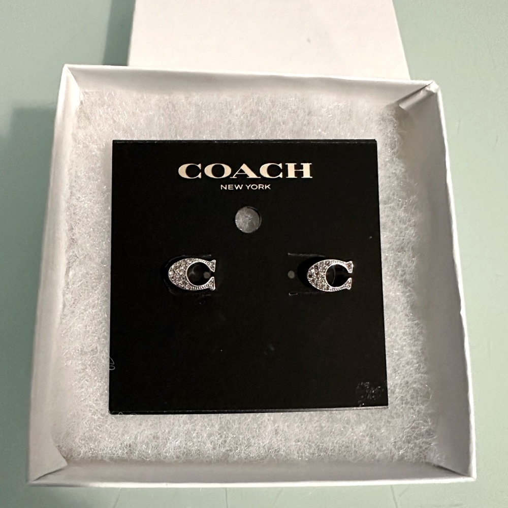 Coach earrings NWT , unique, beautiful, a touch of pure luxury.